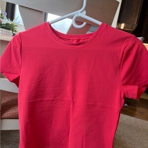 Athleta Bold Pink fitted top, cut out in back super cute!